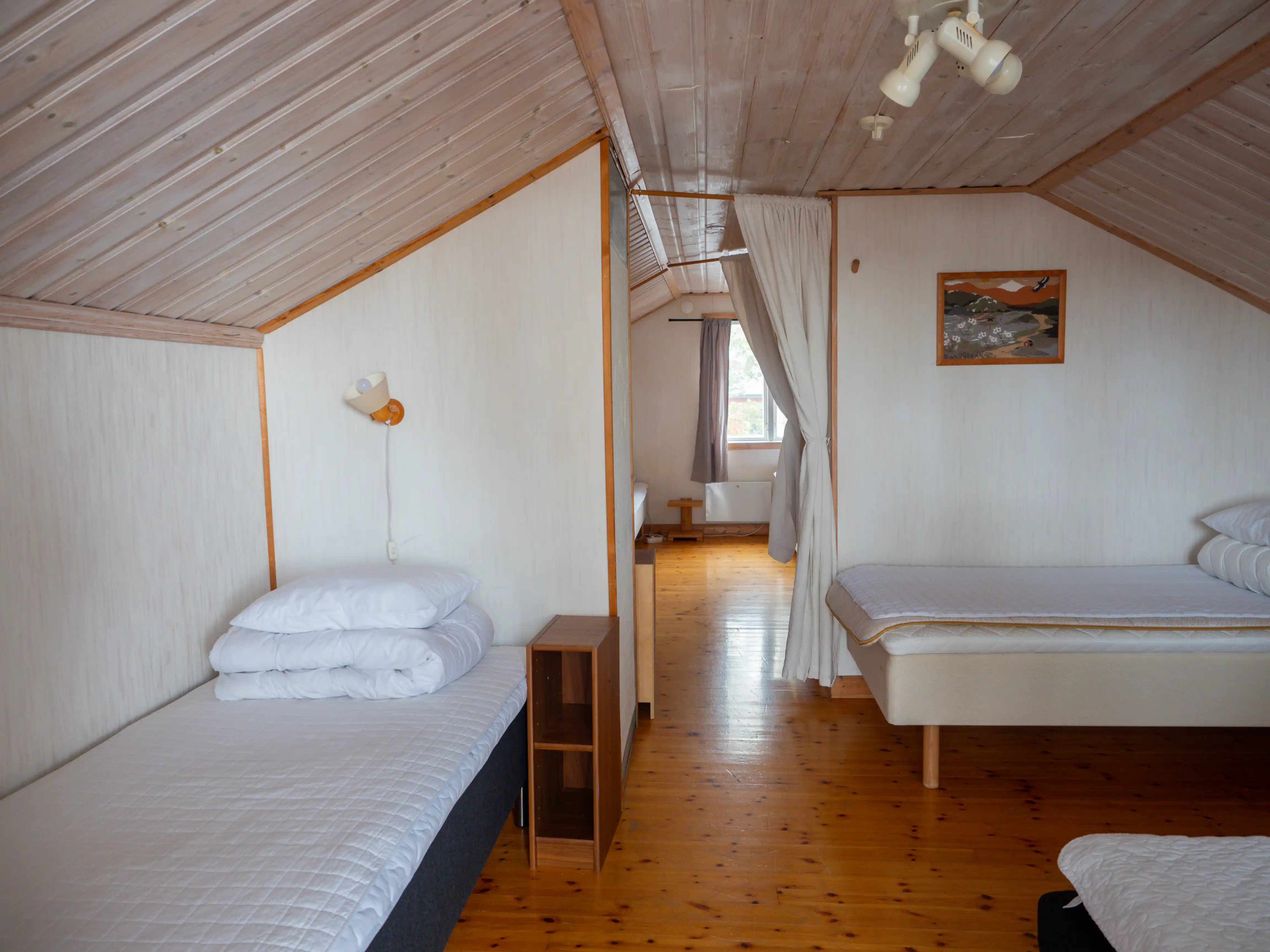 Upstairs bedroom with seven single beds