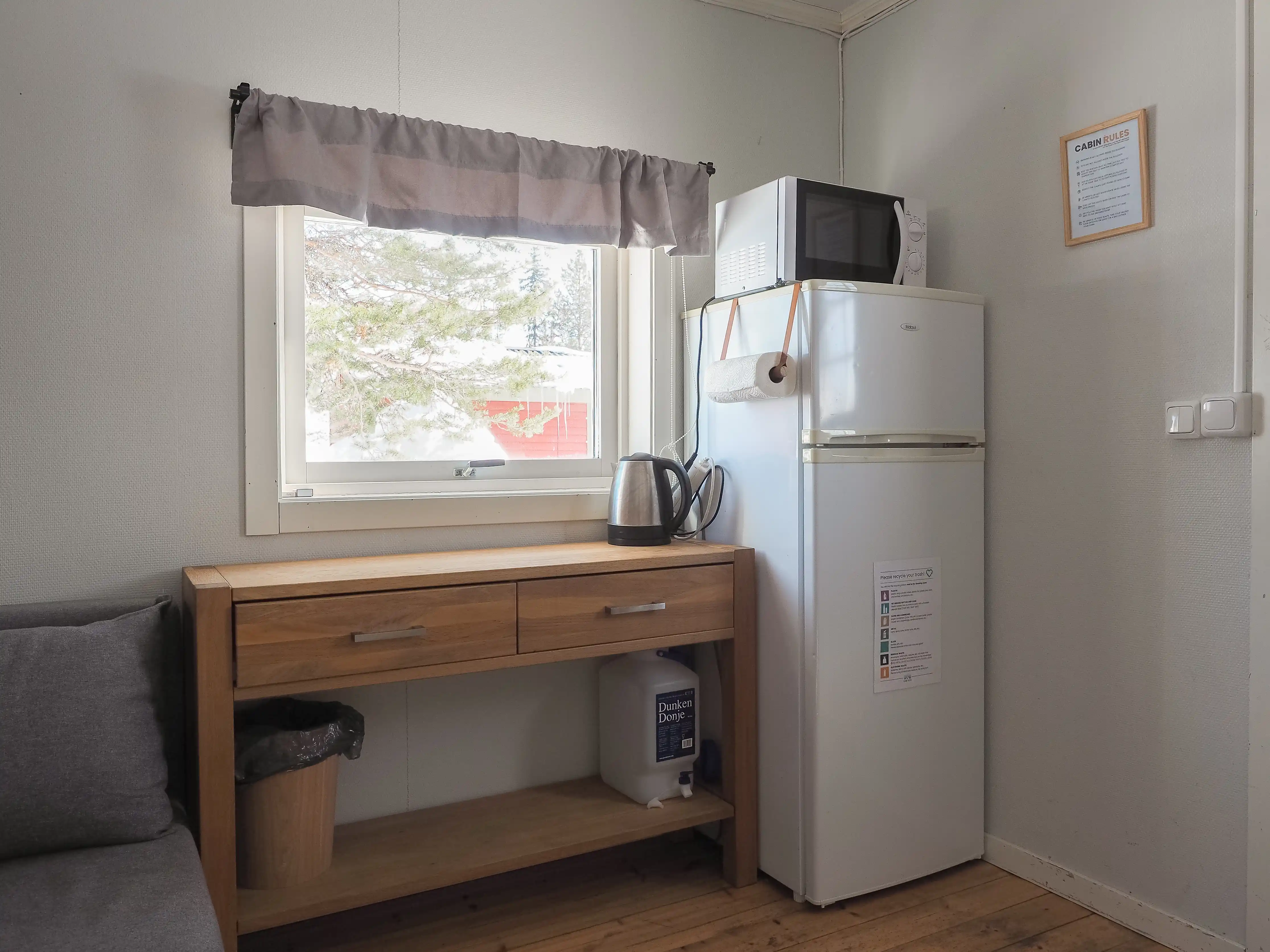 Kitchenette with a microwave, kettle and fridge