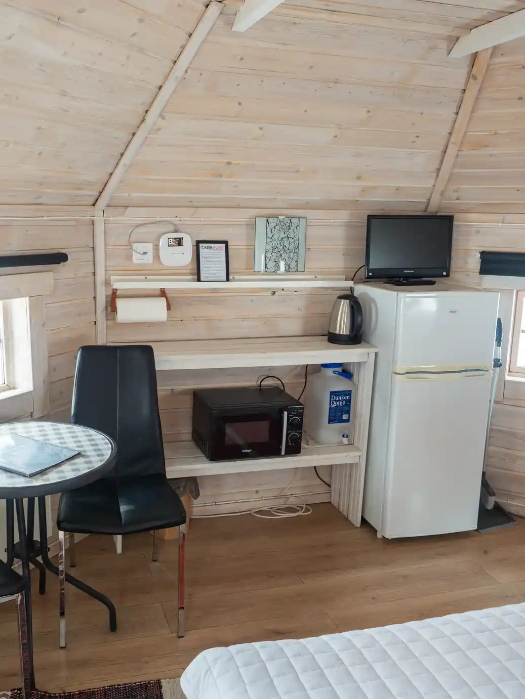 Kitchenette with a microwave, kettle and fridge