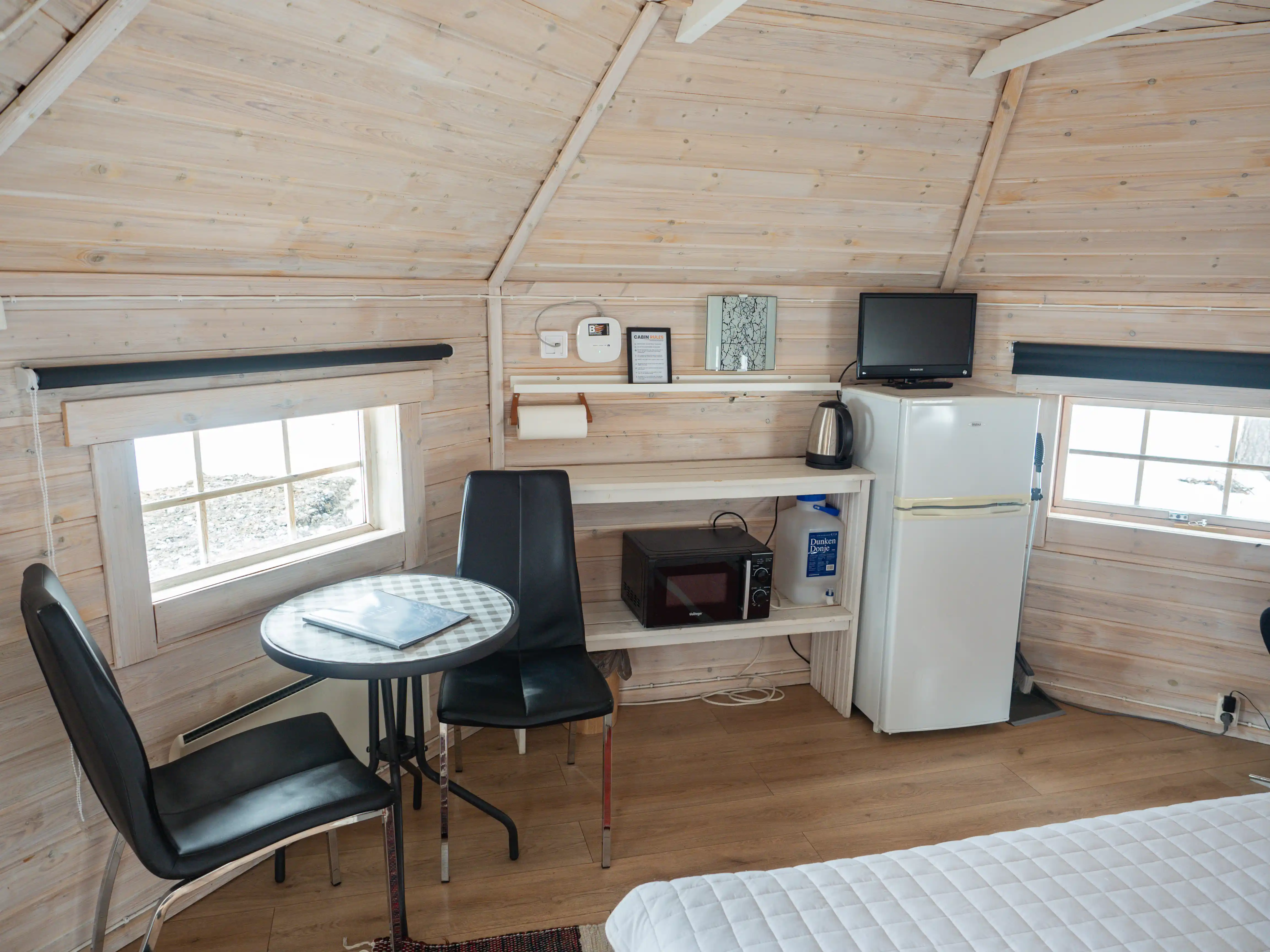 Kitchenette with a microwave, kettle and fridge