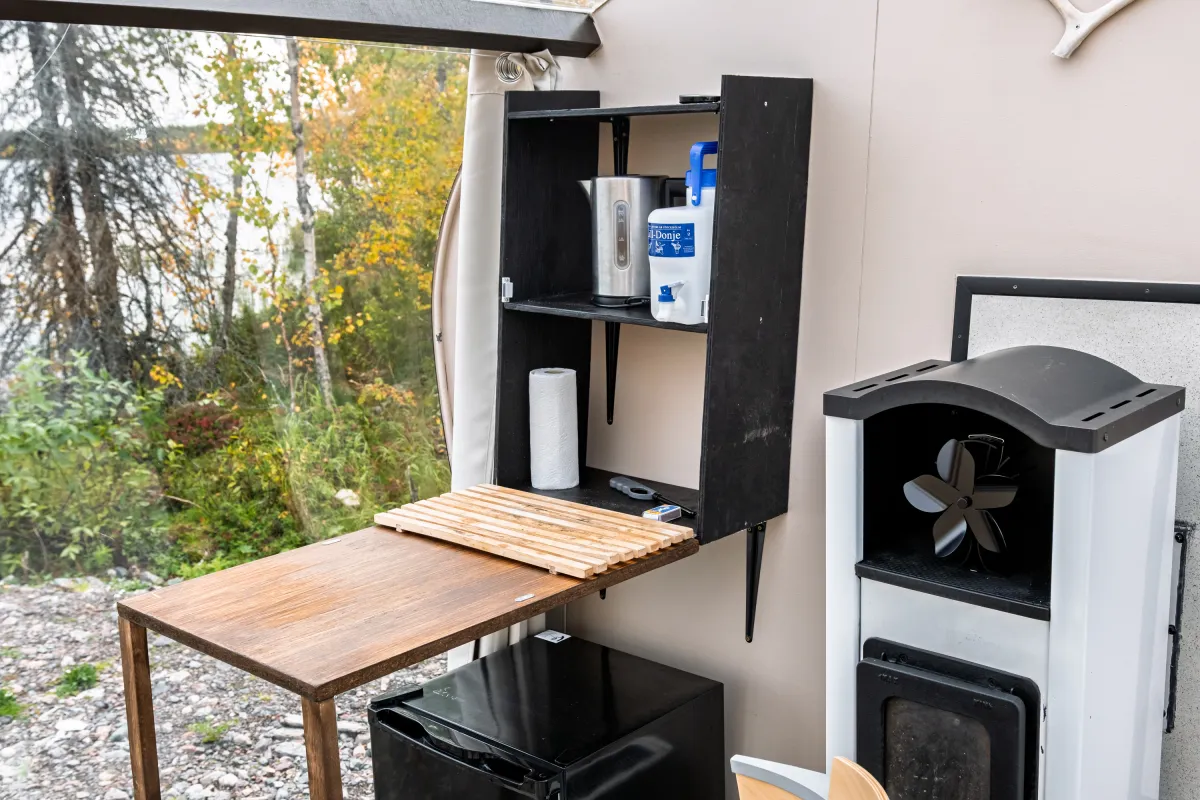Shelf with drinking water tank and the fireplace