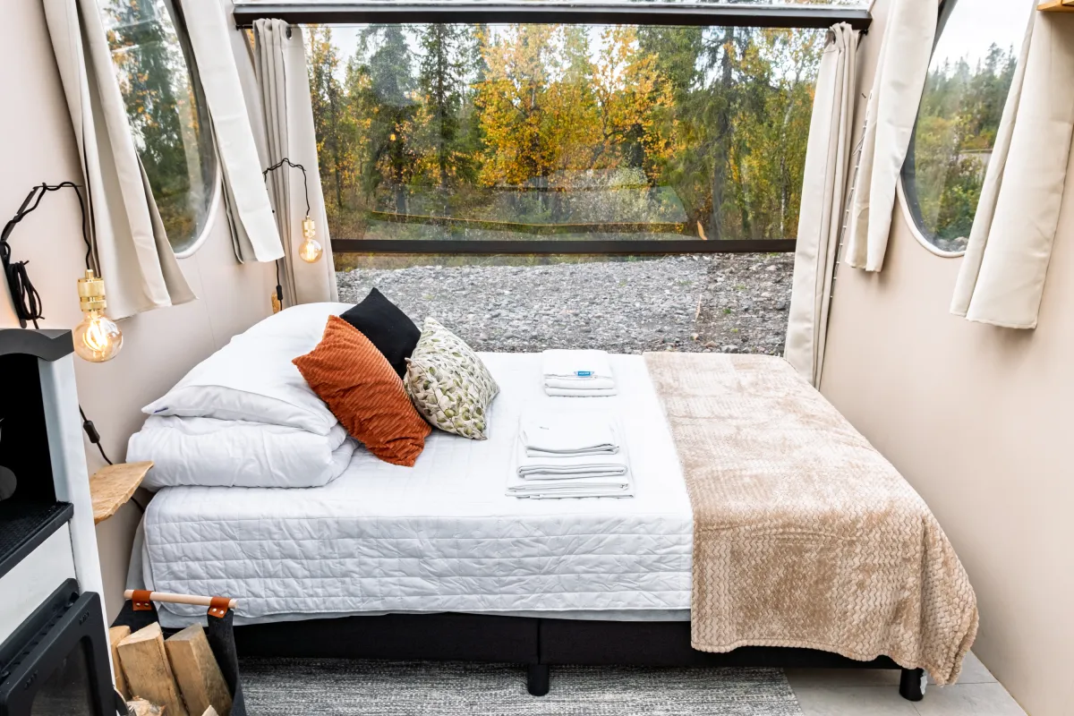 Double bed facing the glass wall