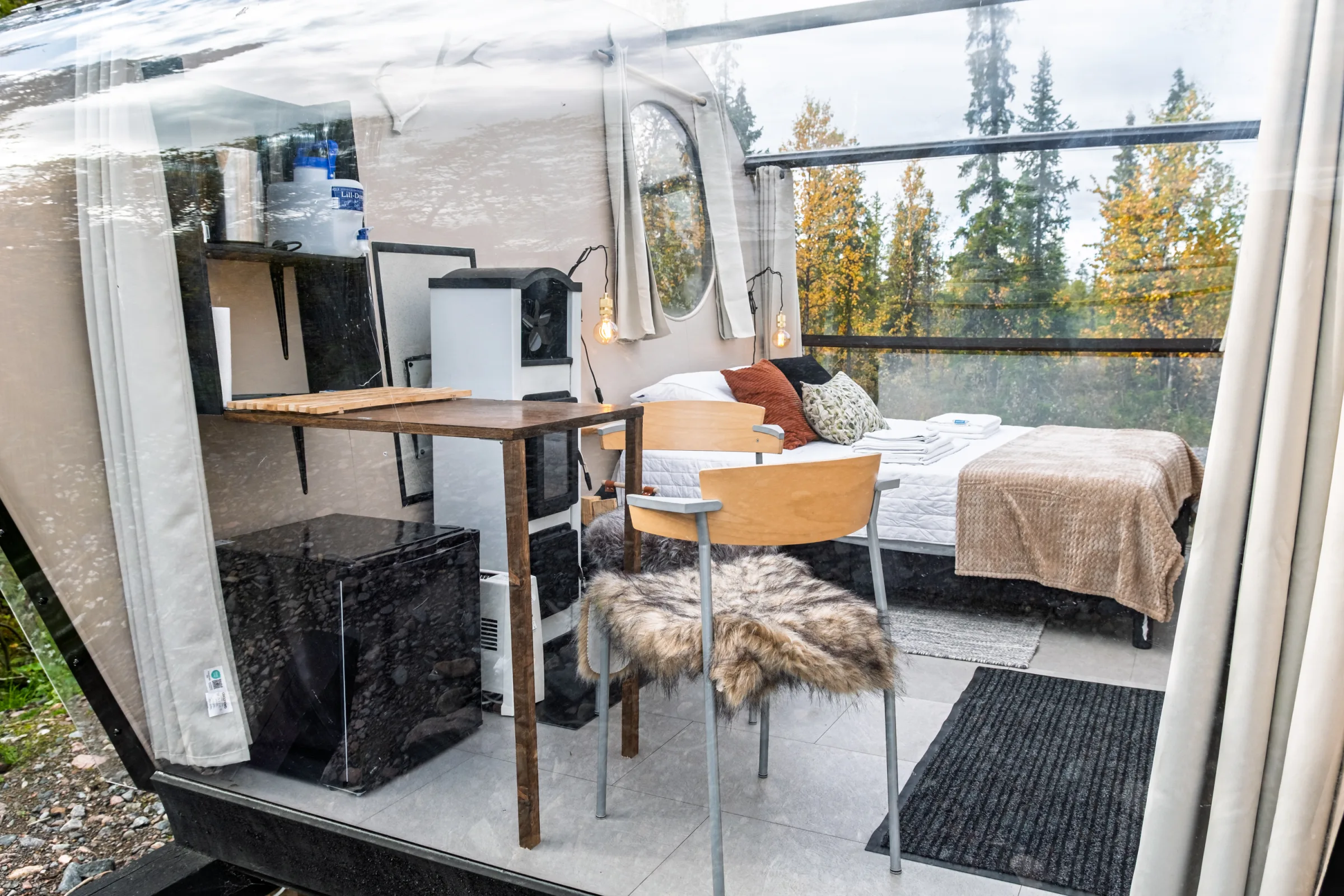The cabin interior seen through the glass wall
