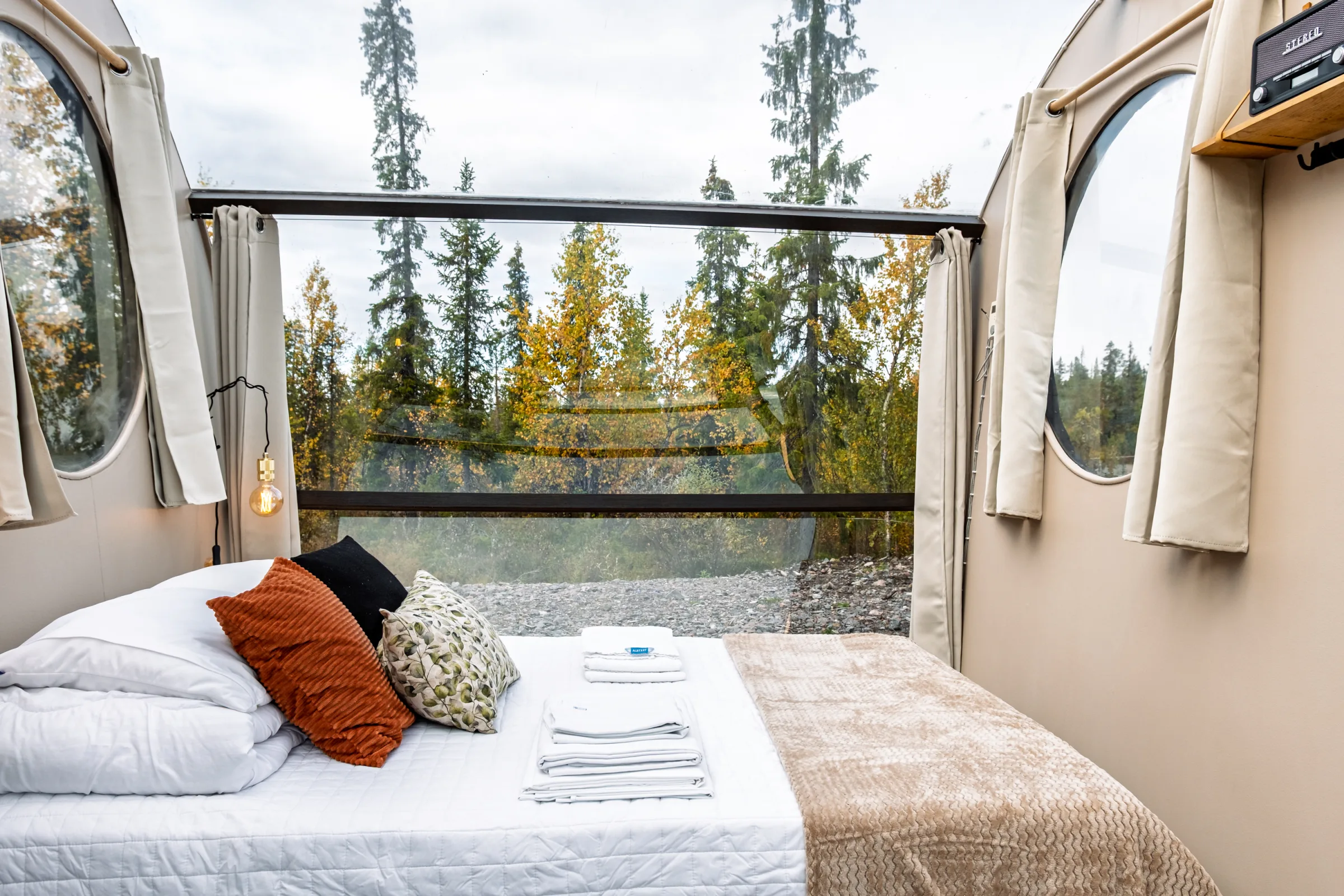 View of the forest and lake from the bed